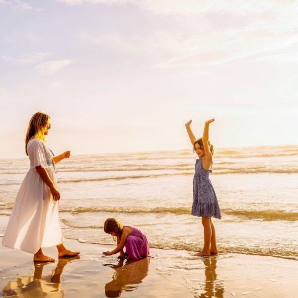 Mother And Children Enjoying The Beach